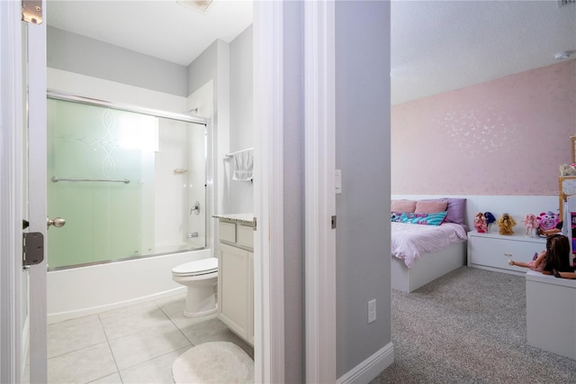 bathroom with tile patterned flooring and bath / shower combo with glass door