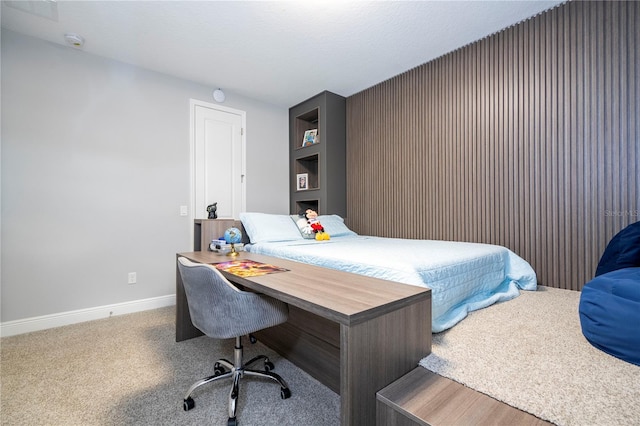 carpeted bedroom with baseboards