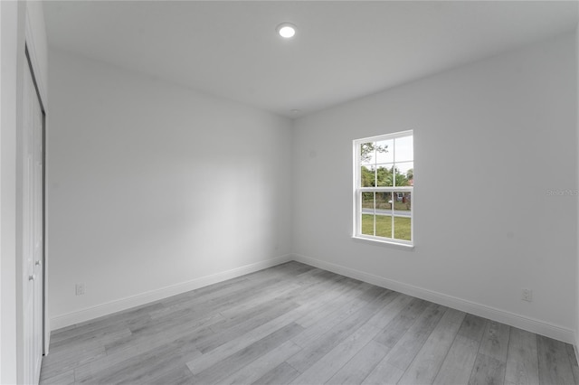 spare room featuring light wood-type flooring