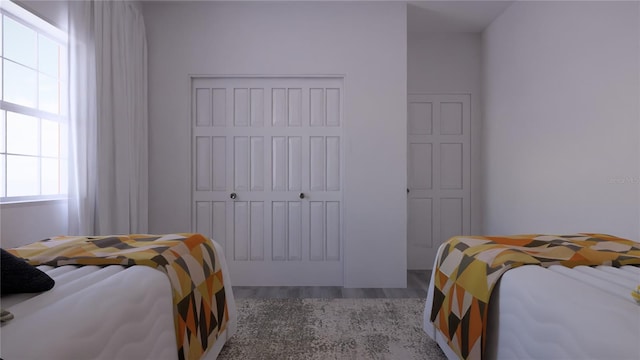 bedroom with hardwood / wood-style flooring