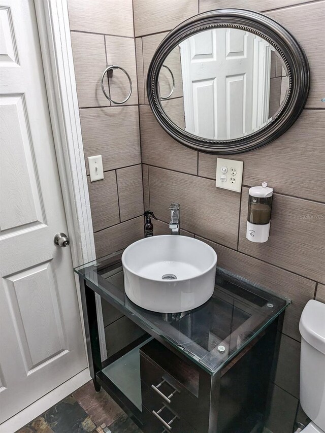 bathroom with vanity and toilet