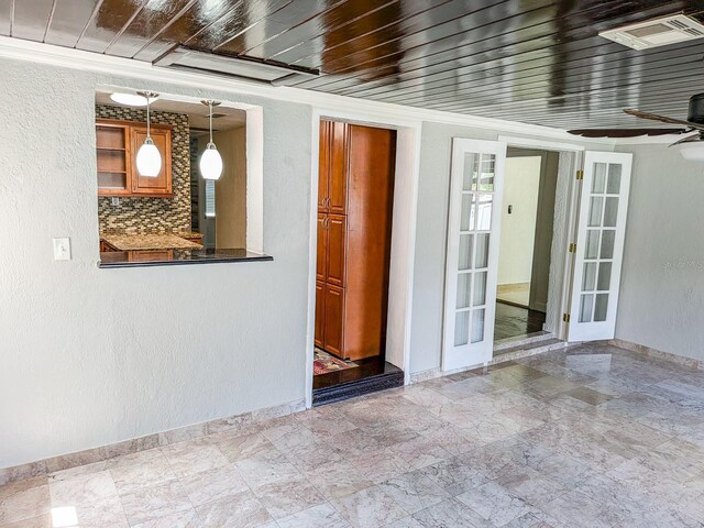 interior space featuring tile patterned flooring, ceiling fan, wooden ceiling, and french doors