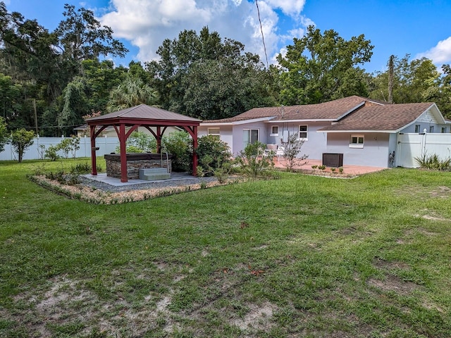 back of house with a patio area, a gazebo, and a lawn