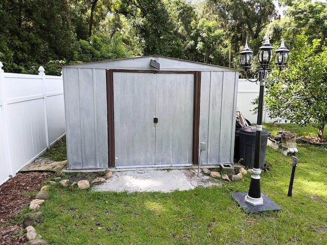 view of outbuilding with a lawn