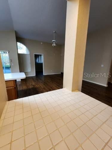 spare room with wood finished floors