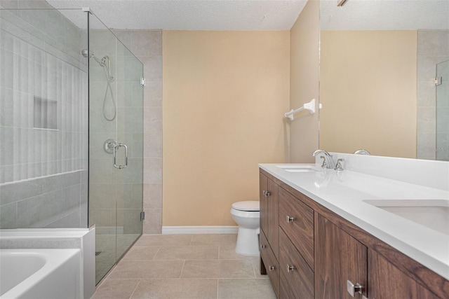 full bathroom with a textured ceiling, vanity, toilet, tile patterned floors, and independent shower and bath