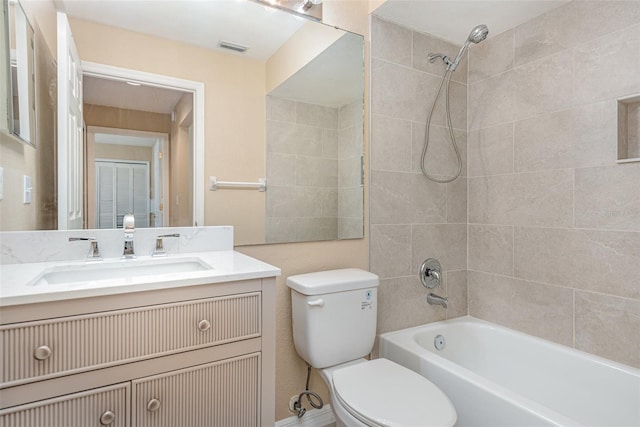 full bath featuring shower / bath combination, visible vents, toilet, and vanity
