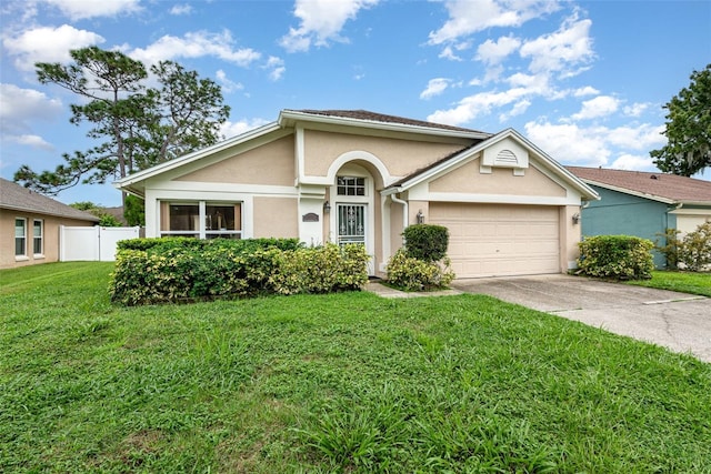 1611 Sand Key Cir, Oviedo, FL 32765 - view of front of property featuring stucco siding, an attached garage, and driveway