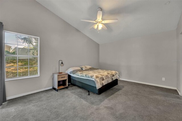 bedroom featuring ceiling fan, lofted ceiling, and carpet