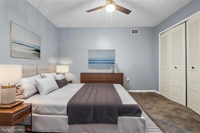 bedroom featuring dark carpet, a closet, and ceiling fan