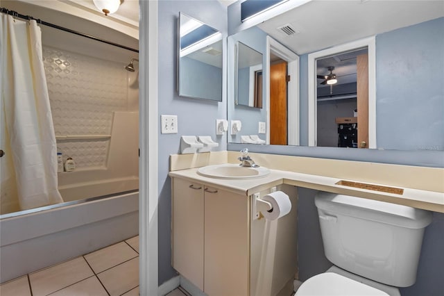 full bathroom with tile patterned flooring, vanity, toilet, and shower / bath combo with shower curtain