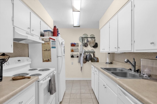 kitchen with decorative backsplash, sink, white cabinets, light tile patterned floors, and white appliances