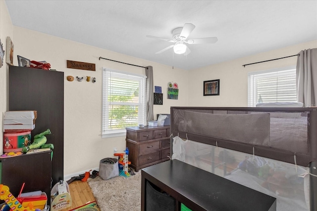 bedroom featuring hardwood / wood-style floors and ceiling fan