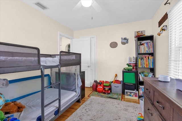 bedroom with ceiling fan and hardwood / wood-style floors