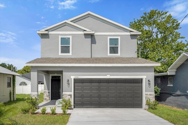 view of front of property featuring a garage