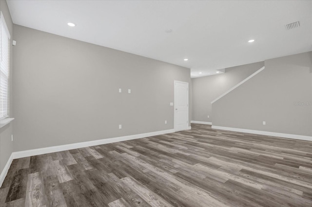 spare room featuring wood-type flooring