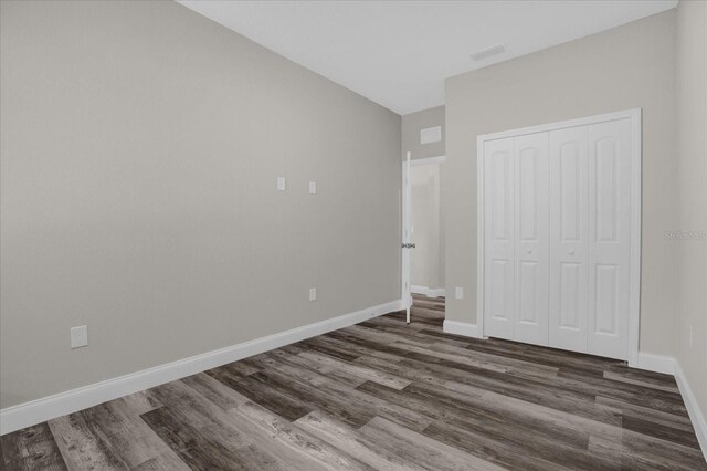 empty room with hardwood / wood-style floors