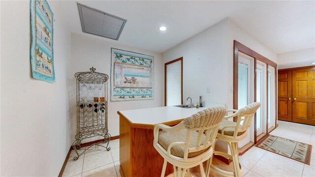 dining space with light tile patterned flooring