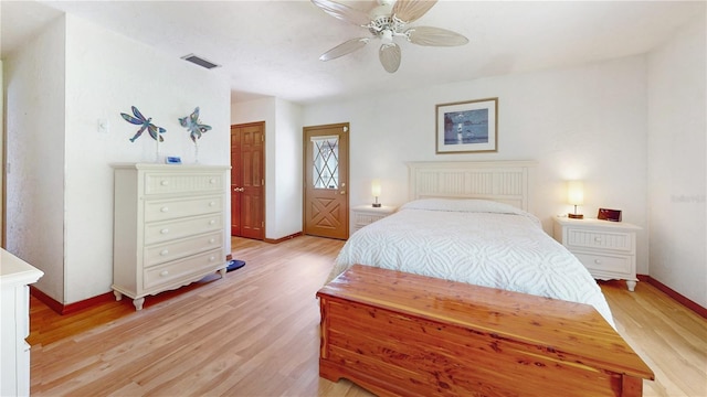 bedroom with ceiling fan and light hardwood / wood-style floors