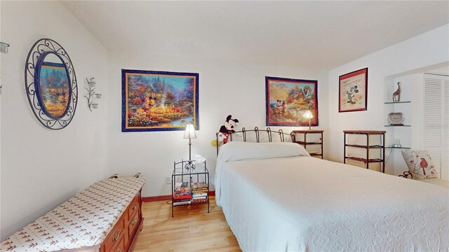 bedroom with light hardwood / wood-style flooring