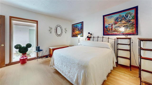 bedroom with light wood-type flooring