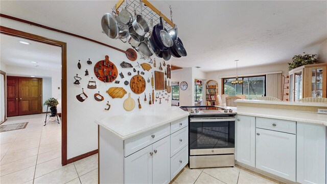 kitchen featuring kitchen peninsula, white cabinetry, stainless steel range with electric cooktop, and light tile patterned floors