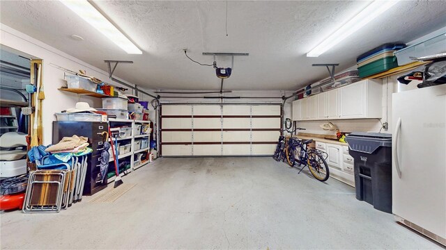 garage featuring white refrigerator