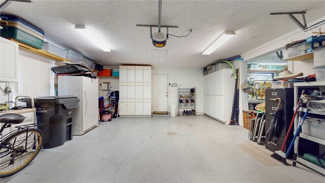 garage featuring white refrigerator