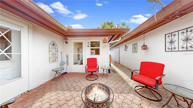 view of patio / terrace featuring a fire pit