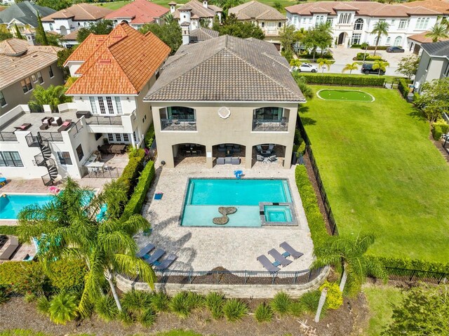 view of pool featuring a yard and a patio