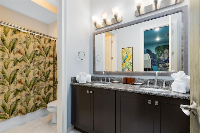 bathroom featuring ornamental molding, vanity, toilet, and tile patterned flooring