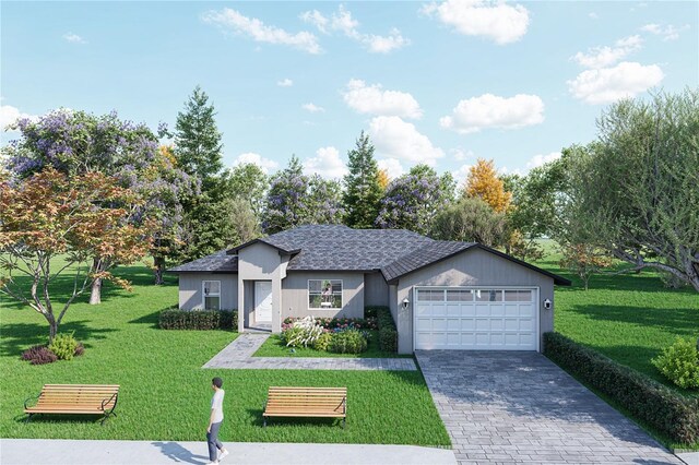 view of front of house featuring a front lawn and a garage