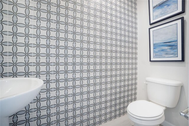 bathroom with sink and toilet