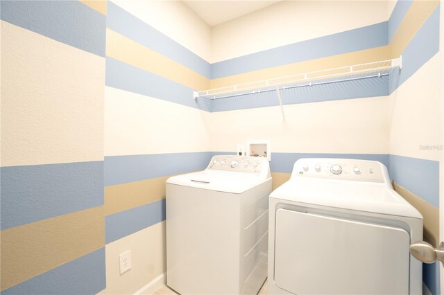 laundry area featuring washing machine and clothes dryer