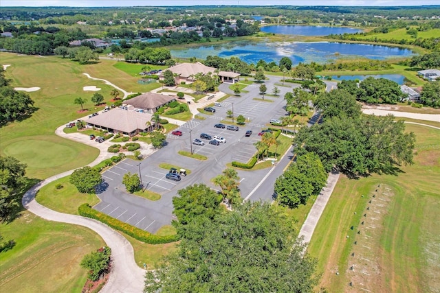 bird's eye view featuring view of golf course and a water view