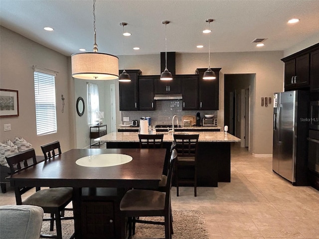 tiled dining area featuring sink