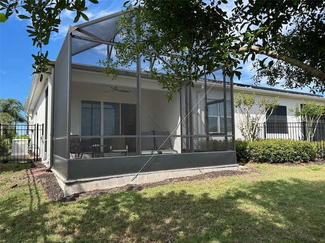 rear view of house with a yard