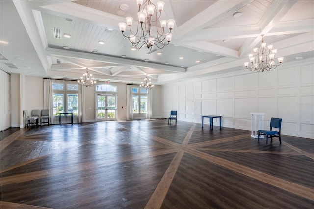 exercise area featuring dark hardwood / wood-style floors, coffered ceiling, and a chandelier