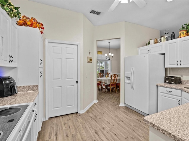 kitchen with ceiling fan with notable chandelier, white cabinets, hanging light fixtures, white refrigerator with ice dispenser, and light hardwood / wood-style floors