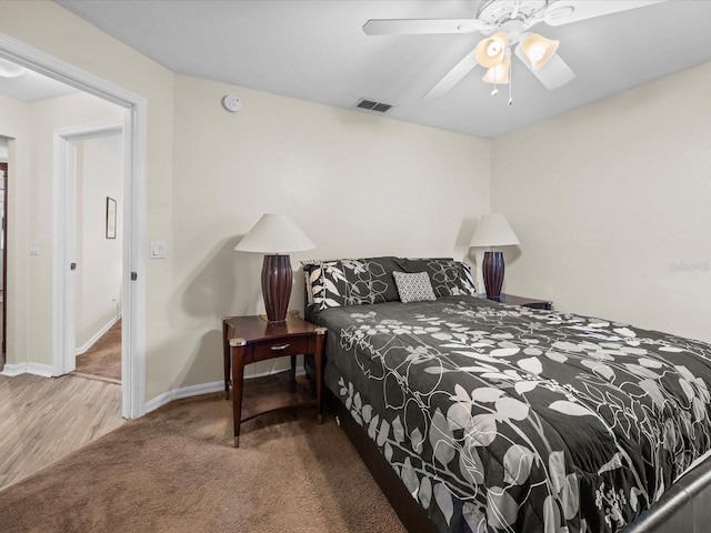 bedroom featuring ceiling fan and carpet