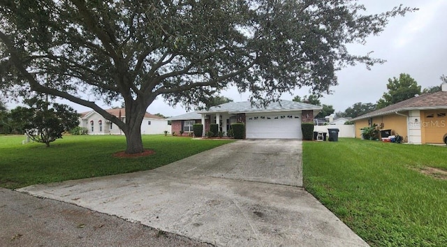 single story home with a garage and a front lawn