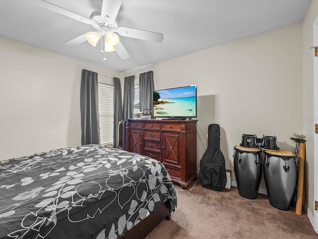 bedroom with ceiling fan and carpet