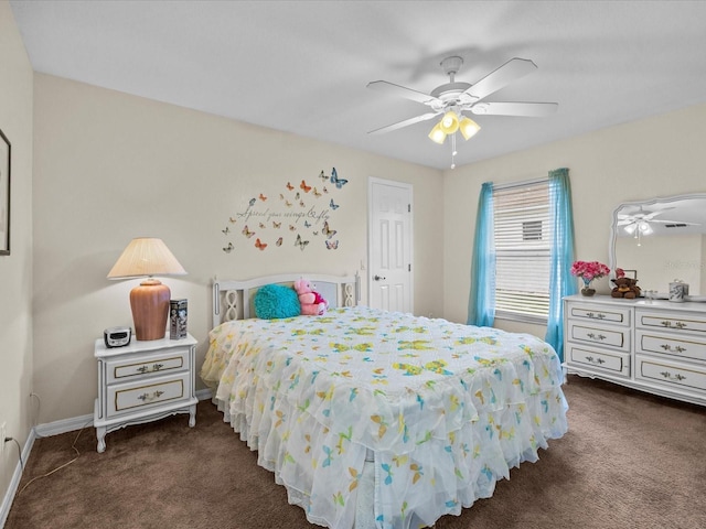 bedroom featuring ceiling fan and dark carpet