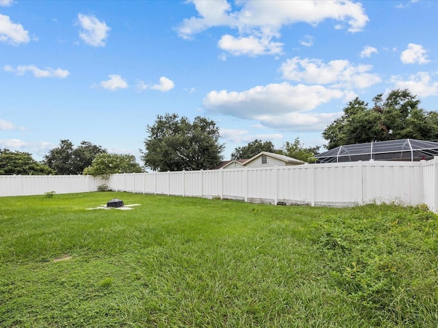 view of yard with an outdoor fire pit