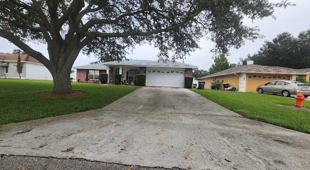 single story home featuring a garage and a front lawn