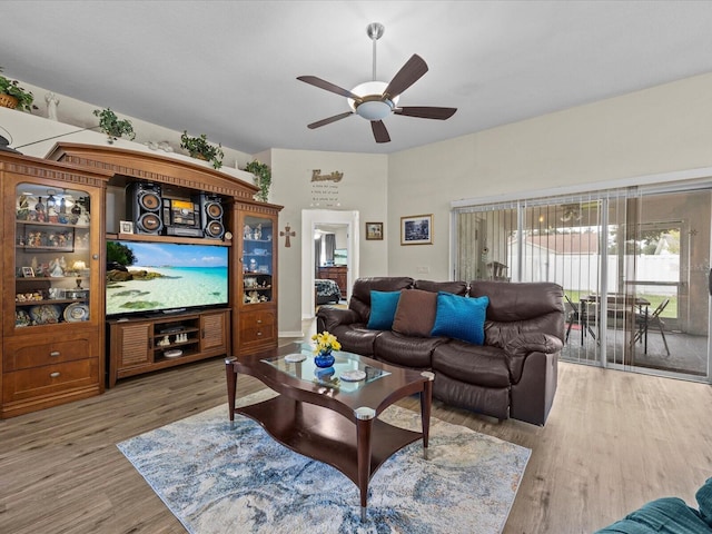 living room featuring ceiling fan and wood-type flooring