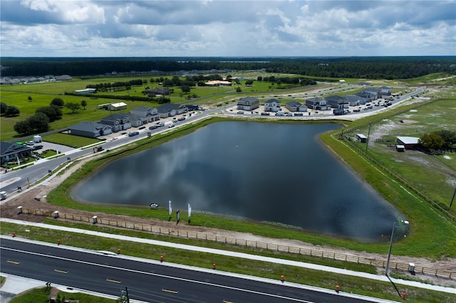 aerial view with a rural view and a water view