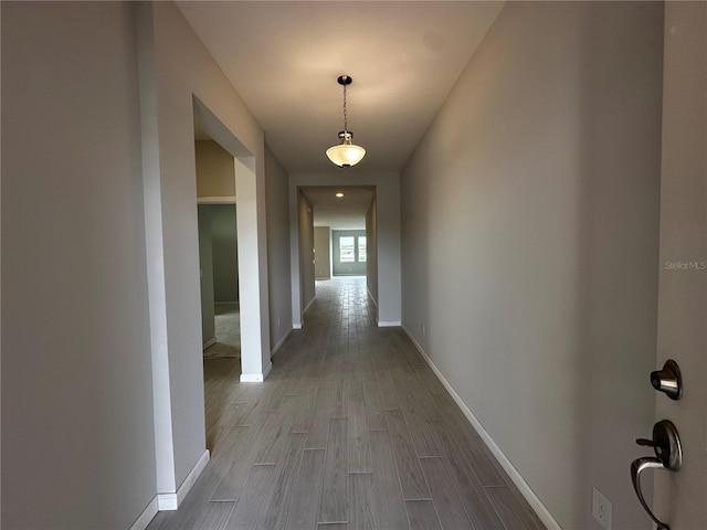 corridor featuring light hardwood / wood-style floors