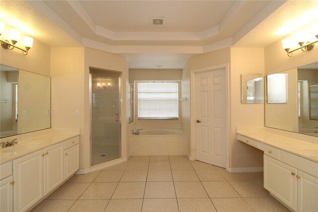 bathroom featuring tile patterned flooring, vanity, and independent shower and bath