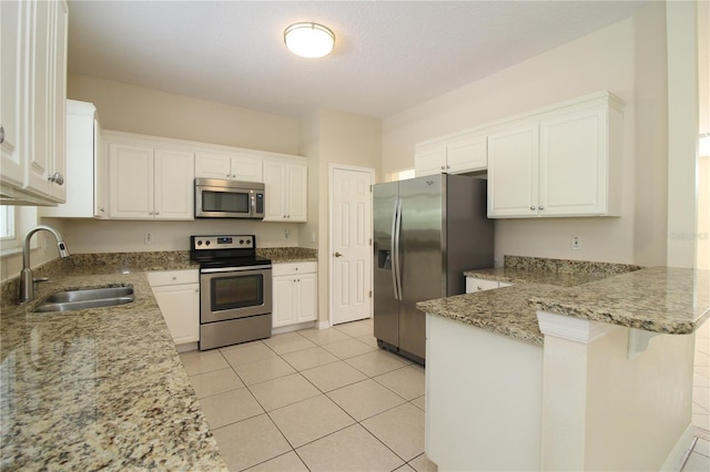 kitchen with white cabinets, sink, and stainless steel appliances